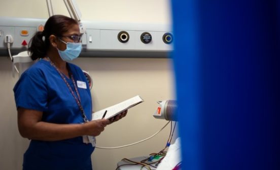 Patient speaking to NHS staff