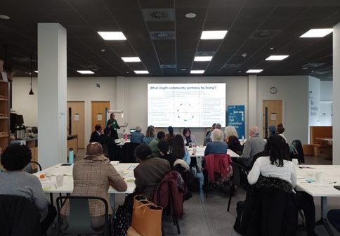 PERC Training session with a large screen at the front