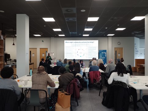 PERC Training session with a large screen at the front