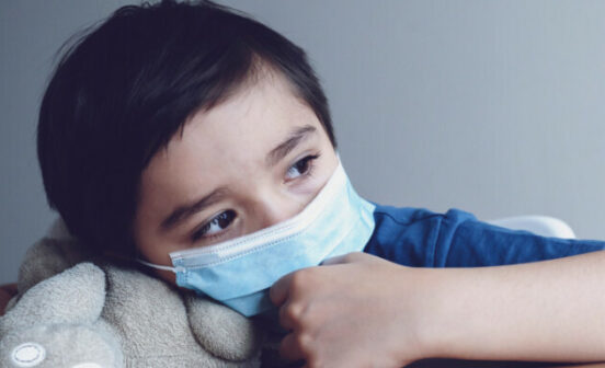 Child,Wearing,Medical,Face,Mask,Lying,His,Head,On,Teddy